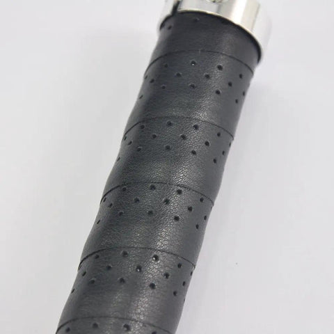 Close-up of black Grippy Leather Double Lock On Bike Grips 22.2mm for mountain and road bikes showing texture and aluminum clamp.