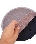 Grab A Crazy Fresh Pack Of 50 Nine Inch Mesh Sanding Discs, showing the hook and loop backing for easy attachment.
