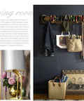 Top Tier Wall Mounted Coat Rack Featuring Durable Brass Hooks And Streamlined Nordic Shape For Your Busy Hallway, holding jackets and bags.