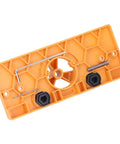 Get Ready For Serious Woodworking With This Ultimate Hinge Hole Saw Jig Set showing an orange plastic jig base with hexagonal design and metal components.