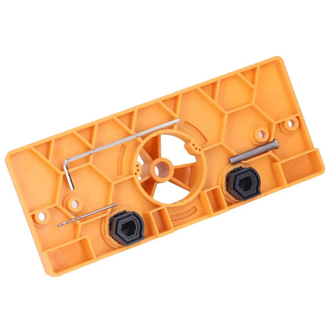 Get Ready For Serious Woodworking With This Ultimate Hinge Hole Saw Jig Set showing an orange plastic jig base with hexagonal design and metal components.