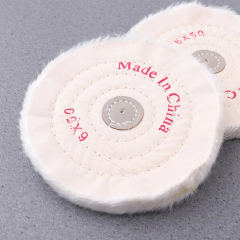 Low Noise 6 Inch Cloth Buffing Wheels 2 Pack White Felt Polishing Pads, close-up showing stitching and center hole on gray surface.