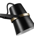 Close-up of Dope Modern Industrial Swing Arm Wall Sconce in Matte Black with Brass Accents, plug-in or hardwire option.