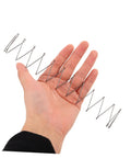 Hand holding Two Pack Industrial Trapezoidal Flat Compression Springs 1x9.5x35x160mm for heavy-duty machinery
