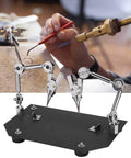 Two Clip Welding Fixture Station With Adjustable Rotating Table Clips For Soldering And Repairs, helping hand in use.