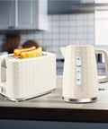 1.7L Electric Kettle With Fast Boil 1200W For Quick Hot Water, 360 Degree Cordless Design in beige next to toaster