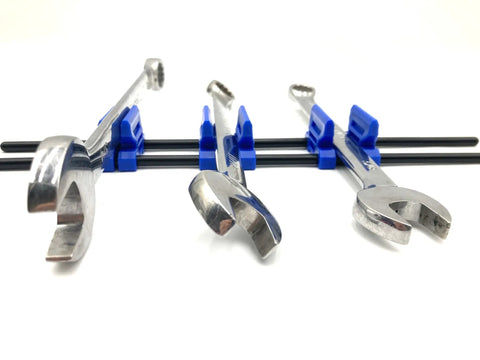Blue clips holding wrenches in the Space Saving 42 Wrench Organizer Set With Infinitely Adjustable Dividers on black rods.