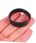 Close-up of a hand holding one black elastic rubber strap from Diving Fixing Bands 5 Pieces 1.25In Elastic Rubber Straps For Secure Backplate And Waist Belt In Sidemount Setup Rugged Scuba Wing Accessories For Outdoor Dive Gear Enthusiasts.
