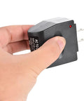 Plug And Go AC To DC Conversion Wall Outlet Adapter held in hand, compact design for 12 Volt 500 Milliamp charging.