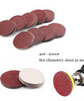 100 pc Assorted Sandpaper Grits With Polishing Pads For Metal And Wood Grinding, assorted sanding discs stacked, 50mm diameter.