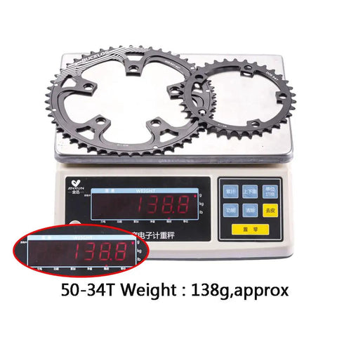 110 BCD Aluminum Bike Chainring Set With Pin 5 Bolt Double Round For Road Bikes on scale showing 138.8g weight