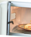Close-up of microwave interior showing Must Have Ten Piece Microwave Waveguide Cover Mica Insulation Sheets for Heat Resistance and Protection.