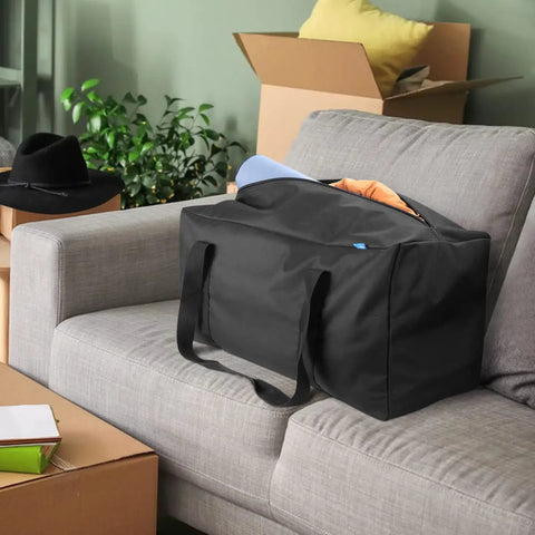 Mid-Size Weekender Travel Duffle Bag, 24x12x12 Inch, 53L Capacity sitting on grey couch, showcasing spacious main compartment
