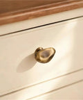 Antique Style Chrome Furniture Handles And Cabinet Knob Set for drawers, close-up of single knob on cream drawer, smooth finish.