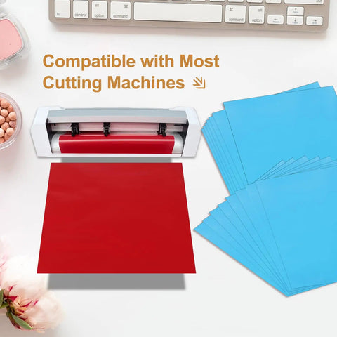 Cutting machine with red vinyl, next to a stack of Light Blue Adhesive Vinyl Sheets Bundle 10 Pcs 12 By 12 Self Adhesive Matte Metallic Vinyl.