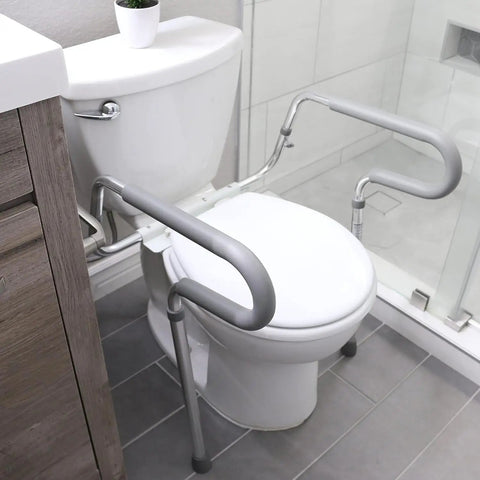 Solid Adjustable Toilet Safety Rails For Seniors Offering Smooth Bailout Support With Non Slip Padded Arms Heavy Duty 300 LB Capacity Top Shelf Bathroom Assist Bars Commode Seat Frame beside toilet.