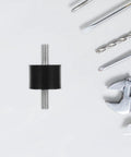 Four Piece Built For The Grind Anti Vibration Rubber Studs M10 Double Screw Mounts cylindrical shock absorber on a workshop table.