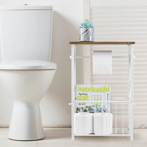 White Metal Bathroom Organizer With Scrollwork And Wood Top Shelf Magazine Basket And Towel Storage Stand For Vanity Or Bath Area Space Saving Table Style Organizer For Toiletries And Magazines beside toilet.