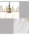 Close-up of the gold fixture and soft white feathers of the Feather Lamp Pendant Light Chandelier for Dining Room Living Bedroom Nordic Drop Lighting.