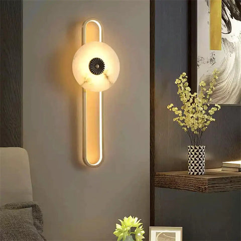 Marble Wall Mount Light With Copper Finish Wabi Sabi Natural Stone Sconce illuminating bedroom with modern decor.