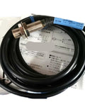 Dead Reliable M12 Inductive Proximity Sensor Featuring A Rock Solid 2.5mm Sensing Range And Normally Open Output visible with a black cable.