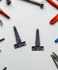 Heavy Duty T-Shaped Iron Door Hinges With Screws For Garden Gates And Big Cabinets on a white background with tools