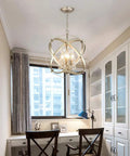 Four Lights Crystal Cage Chandelier With Modern Globe Metal Pendant Lighting in a stylish home office setting.