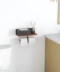 Toilet Paper Holder With Shelf Dual Roll And Wipes Dispenser for bathroom wall, black metal and wood with aromatherapy items.