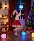 Child playing with 8 Inch Solar Globe Light Outdoor Waterproof with Remote Control, 16 RGB Color Changing Glowing Orb Lamp during holiday