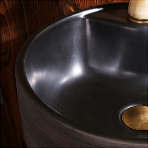 Close-up of Top Shelf Handmade Vessel Sink With Faucet And Drain Pre Drilled Installation Hole featuring a polished black basin.