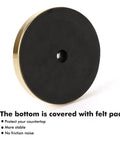 Bottom view of felt-padded base for Freestanding Toilet Paper Holder Stand With Four Roll Reserve, Stainless Steel Brushed Gold Finish.