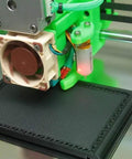 Built Tough Hypercube Evolution 3D Printer Metal Frame Kit With 300X300X300MM Square Build Volume And Complete Black Aluminum Extrusion Hardware Bundle For Kick Ass Smooth Prints close-up view of 3D printer nozzle and fan.