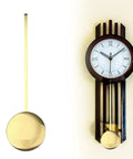 Gold metal pendulum replacement part next to vintage style wall clock with Roman numerals and wood accents.