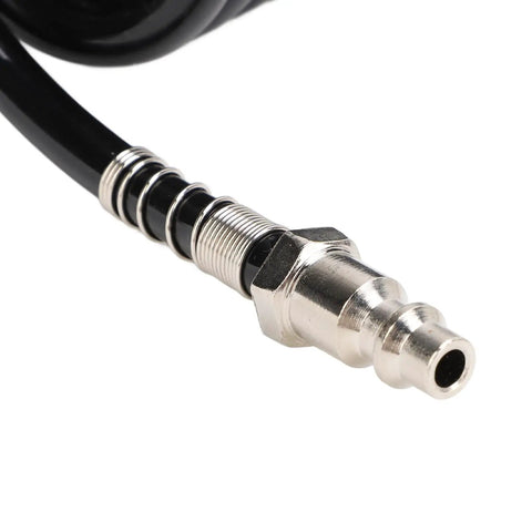 Close-up of Rock Solid Heavy Duty Coiled Air Hose with Bend Restrictor, rubber and steel tubing connector for pneumatic tools.