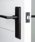 Keep Plate With Dirk Lever In Black Iron For Modern Doors, Matte Black Hardware Set With Clean Lines on White Door