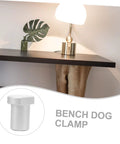 Solid Aluminum Woodworking Bench Dogs And Three Pack Workshop Table Stoppers For Gripping Tight During Heavy Clamping Reliable Workbench Hole Inserts close-up of aluminum bench dog clamp on table surface