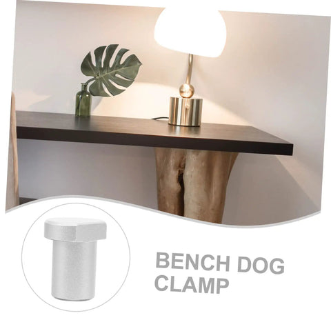 Solid Aluminum Woodworking Bench Dogs And Three Pack Workshop Table Stoppers For Gripping Tight During Heavy Clamping Reliable Workbench Hole Inserts close-up of aluminum bench dog clamp on table surface