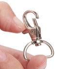 Legit Heavy Duty Swivel Hook Clasps 40 Piece Kit 1 Inch D Ring Connectors For Lanyards Bags And Craft Projects Solid Metal Build shown held in hand.