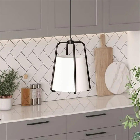 11 Inch Wide Pendant Light With Blackened Bronze Outer Frame And White Fabric Shade in a modern kitchen setting.