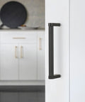 Close-up of 10 Pack 5 Inch Matte Black Knurled Cabinet Pulls for Cabinets and Drawers installed on a white kitchen cabinet door.