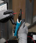 Electrician using 6-Piece Hand Tool Kit For Electricians Durable Professional Grade Includes 2 Screwdrivers 3 Pliers Wire Stripper And Cutter Made In USA With Non Slip Grips And Rivet Closers For Maximum Cutting Power to strip wire