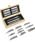 Open wooden chest with precision craft hobby knives and interchangeable razor sharp blades for scrapbooking and art projects.