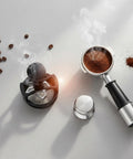 Solid Game Changer Espresso Pin Distributor And Coffee Clump Breaker Tool For Portafilter, Heavy Duty Aluminum Barista Essential With Comfort Grip, Quick Rinse Black 58 Mm For Smooth Daily Brews on countertop with coffee beans and grounds.