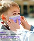 Child wearing Kids Face Masks Pack Of 50 Three Ply Disposable With Colorful Designs, snug nose wire, outdoor setting