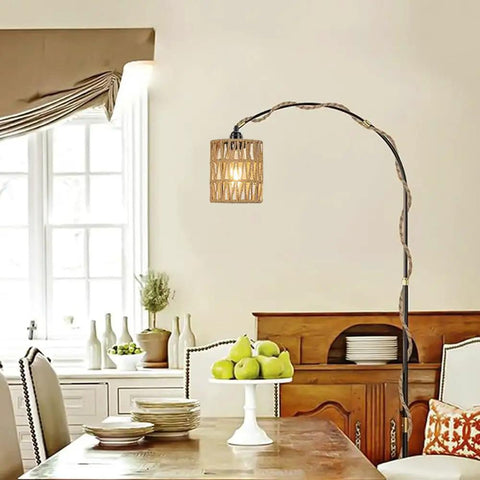 Straight Up Chic Boho Woven Rattan Plug In Pendant Ceiling Light casting dreamy art deco wall shadows in a cozy dining room.