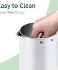 Ultra Compact 0.6L Electric Kettle Travel Ready On The Go Stainless Steel Mini Hot Water Boiler Double Wall Cool Touch Portable Teapot Auto Shut Off Boil Dry Protection 120V 800W White Finish with hand inside for easy cleaning.