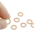 100 Pack M5 Copper Flat Washers 5X9X1mm held between fingers with others on a white background, rust proof hardware fasteners.