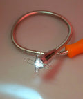 24 Inch Flexible Magnetic Pickup Tool With LED Light, stainless steel wand, illuminated on white surface