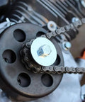 Badass Go Kart Clutch Bolt Kit Featuring Precision Metric M8 And Five Sixteenths Inch Drive Fasteners Paired With Rugged Lock Washers For Rock Solid Three Quarter Shaft Engines on a quad bike's engine.