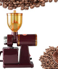 Portable Stainless Steel Electric Conical Burr Coffee Grinder With Eight Gear Precise Settings For Espresso Drip French Press Spice Nut And Grain Grinding on a counter with coffee beans.
